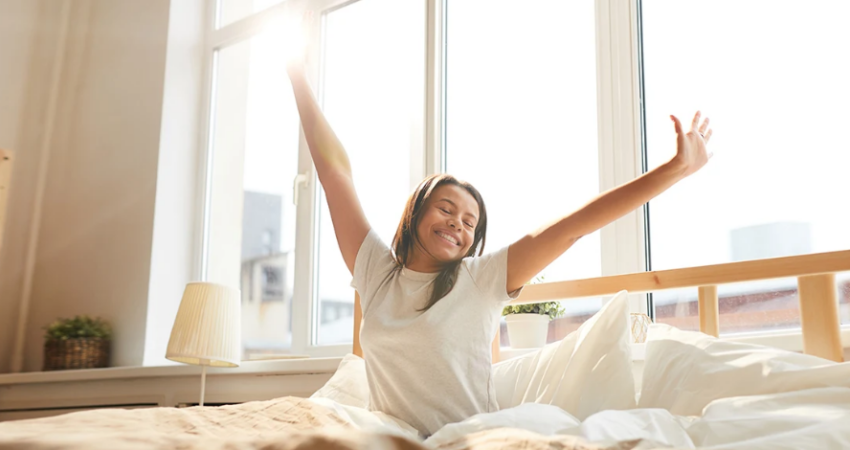 Woman waking up from restful sleep