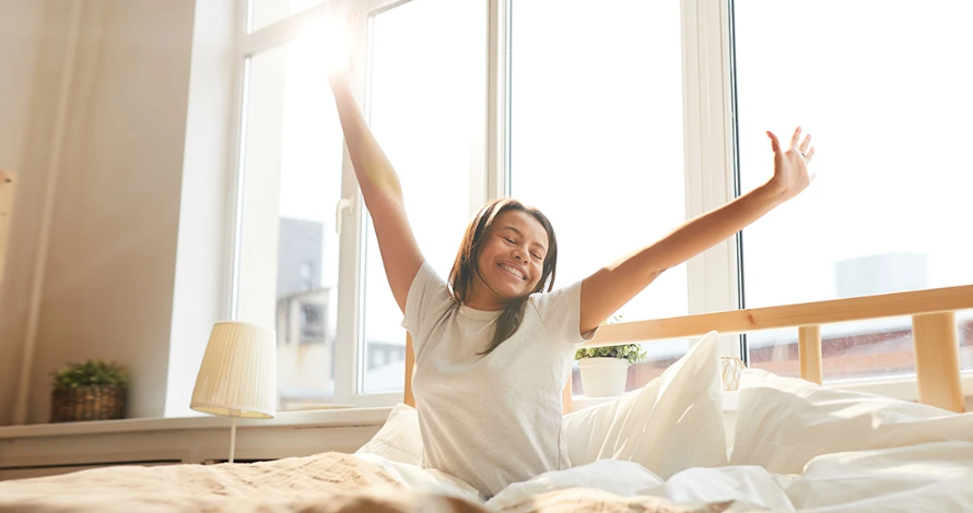 Woman waking up from restful sleep